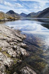 Stunning landscape of Wast Water with reflections in calm lake w