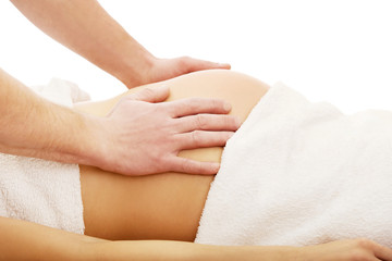 Fototapeta na wymiar Pregnant woman having a relaxing massage