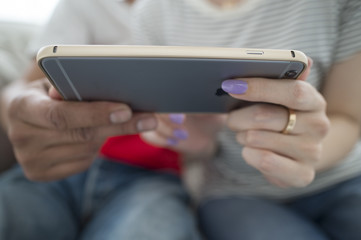 Couple watching a movie together in the smartphone