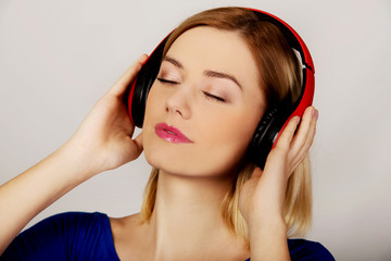 Fototapeta premium Woman with headphones listening to music. 