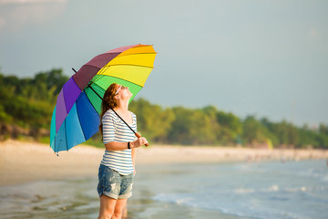 Attractive caucasian woman wearing sunglasses holding colourful