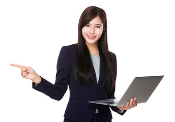 Asian businesswoman hold with laptop computer and finger point a