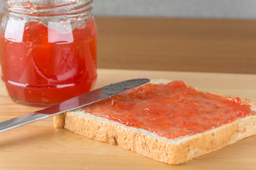 whole wheat bread with strawberry jam