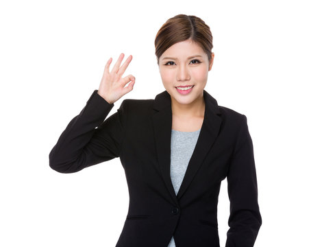 Asian businesswoman with ok sign gesture