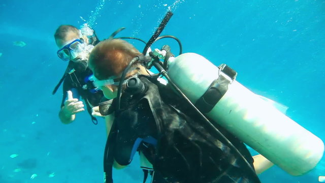 Boy and Man Dive with Equipment