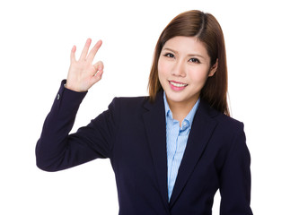 Businesswoman with ok sign gesture