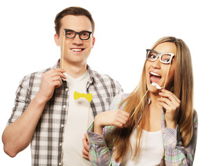 lovely couple holding party glasses on stick