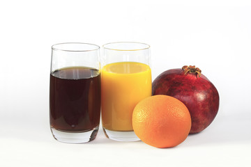 The pomegranate, the orange, glass of pomegranate juice, glass o