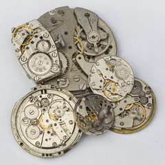 Fototapeta na wymiar Mechanism of old wristwatches with gears and wheels