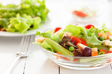 fresh vegetable salad in glass bowl