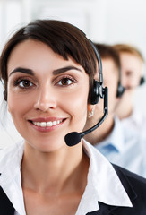 Three call center service operators at work