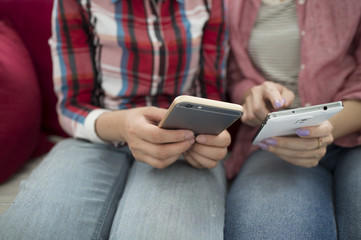 Two women looking at smartphone