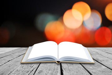 Open book with twilight background