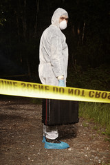 Crime scene investigation - technician with suitcase