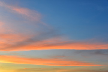 Sunset sky with orange colored clouds. 
