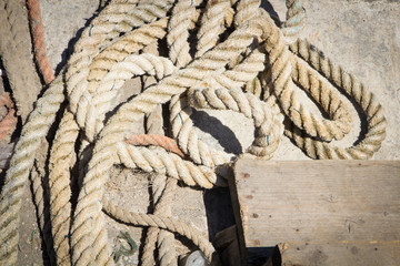Fish net rope on the harbour floor