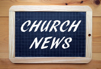 The phrase Church News in white text on a slate blackboard