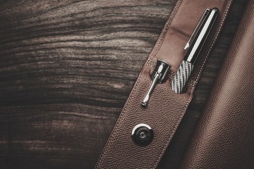 Luxurious rollerball pen on a wooden background