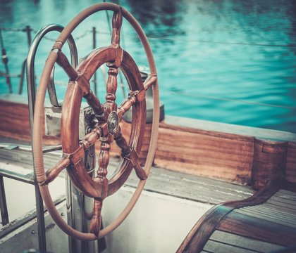 Helm on a vintage wooden yacht