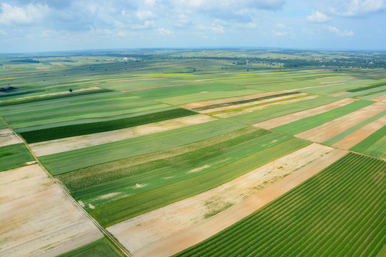 Aerial view of the countryside with village and fields of crops