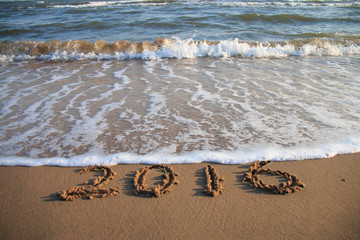 2016 New Year written on the beach