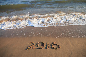 2016 New Year written on the beach