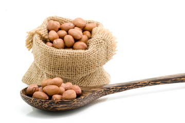 No shell dry peanut in wooden spoon and sack