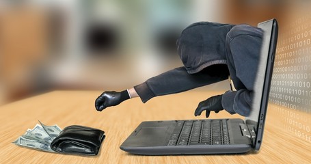 Hacker - thief steals money from laptop