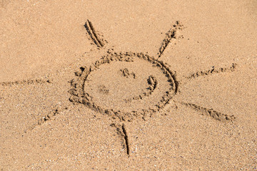 Children Drawing Of Sun Sign On Summer Beach Sand