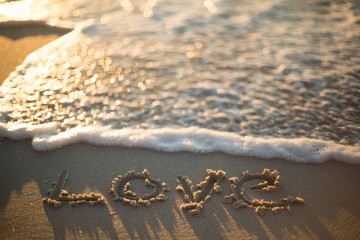 love written on the beach 