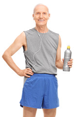 Senior man in sportswear holding a water bottle