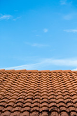 Red Tiles Under Blue Skies