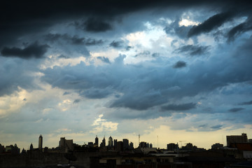 Dark blue storm clouds over city in rainy season