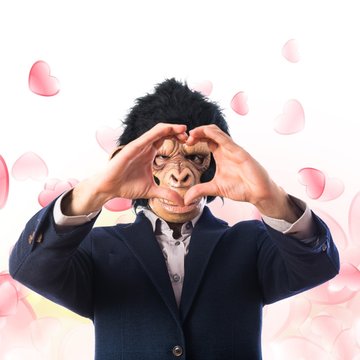 Monkey man making a heart with his hands