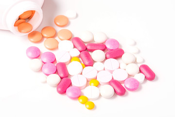 Colored pills, tablets on a white background