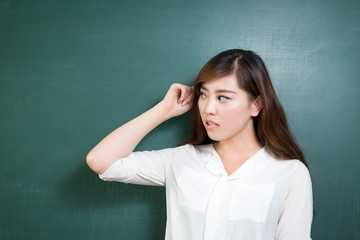 Asian beautiful woman standing in front of blackboard with gesture