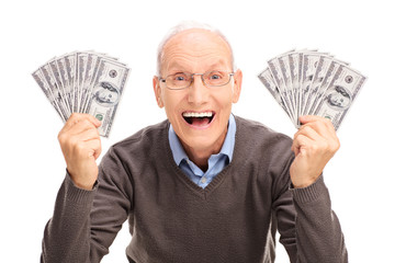 Joyful senior holding money in both hands