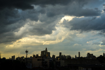 Fototapeta na wymiar Dark blue storm clouds over city in rainy season