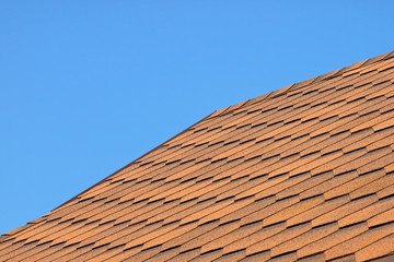 Roof of bituminous tiles.