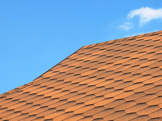Roof of bituminous tiles taken closeup.