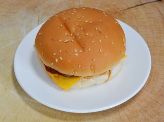 cheeseburger pork and bacon on chop block