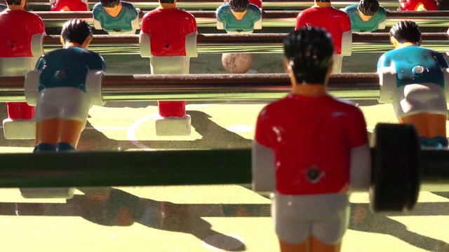 Vintage Foosball Known as Table Soccer, Blue and Red Players in Football Kicker Game, Selective Focus, Retro Cinematic Tone Effect