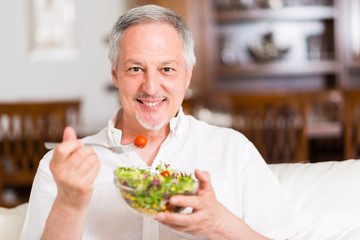 Man eating a salad