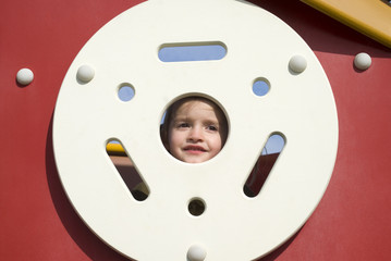 Caucasian girl playing on playground