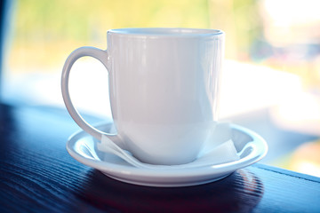 White coffee cup on a airport window background