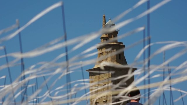 Hercules tower Torre de Hercules  world heritage site with white ribbons in feast of kites