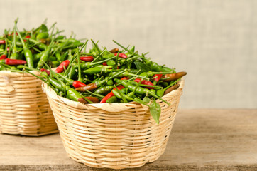 Green and red Thai chili peppers