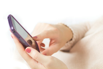 Female hands using mobile