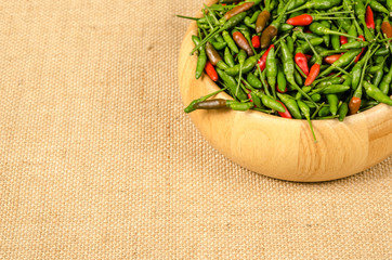 Green and red Thai chili peppers