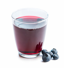 Glass of fresh blueberry juice with blueberries 